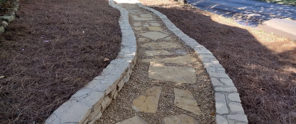 Flagstone walkway and pine straw at a home in Toney, AL.