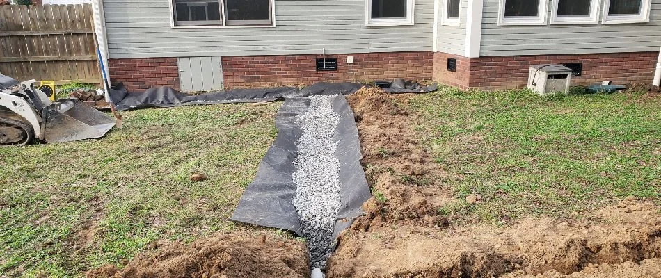 French drain being installed on a property in Huntsville, AL.