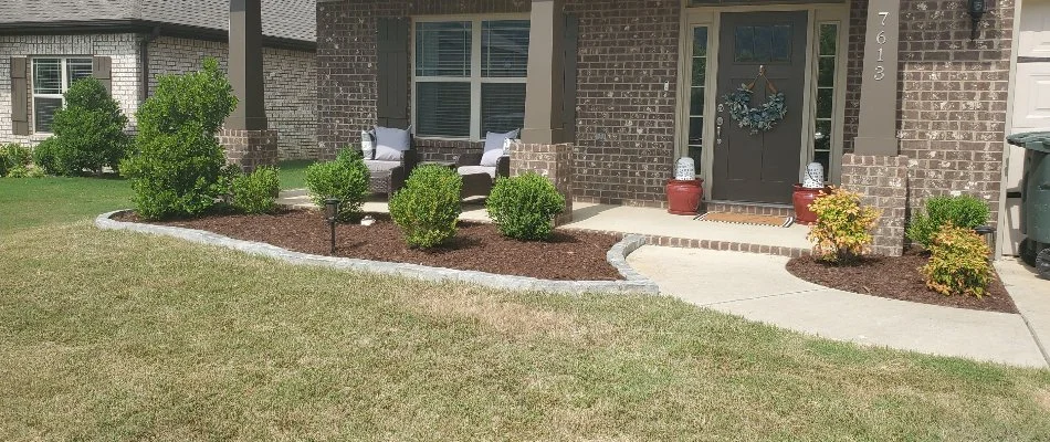 Front landscape in Ashland, AL, with plants and mulch.