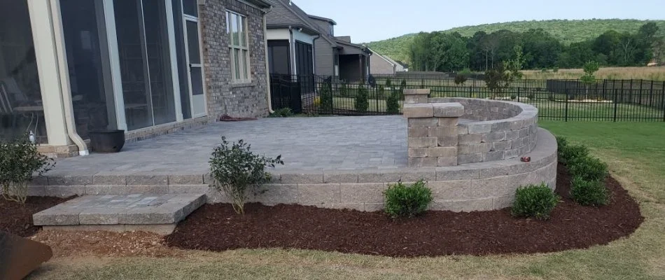 Patio in Lynchburg, TN, with mulched landscape beds.